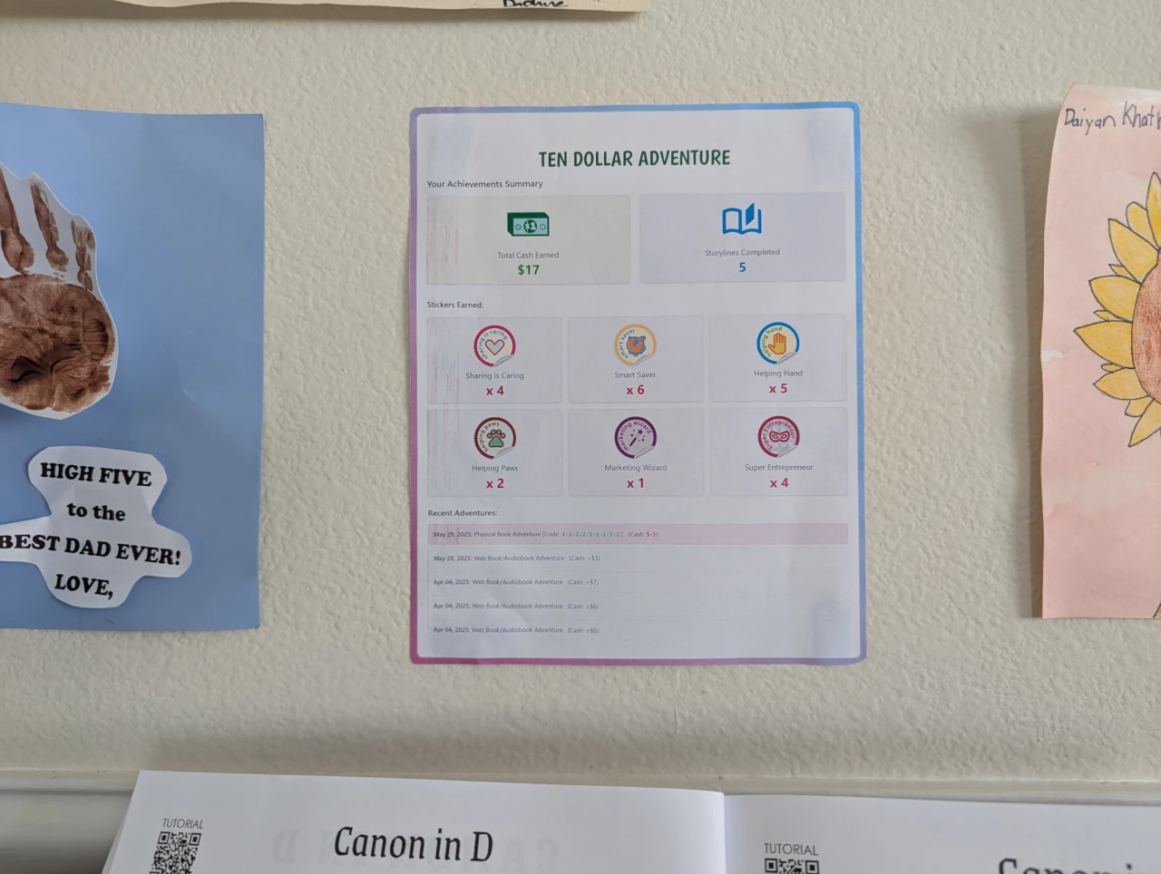 Photo of a printed-out achievement certificate displayed on an art wall